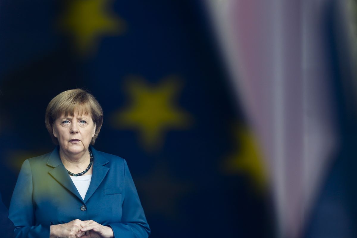 In this Monday, June 3, 2013 file photo, German Chancellor Angela Merkel stand behind a window with a reflection of the European flag as she waits for the arrival of King Willem-Alexander of the Netherlands at the chancellery in Berlin. Angela Merkel will leave office as one of modern Germany