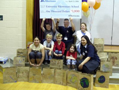 
Students at University Elementary recently received a $1,000 check from Albertsons during an all-school assembly. The  schools' 400 students designed and colored 2,544 paper grocery bags with recycling messages as a part of Albertsons Earth Day coloring contest.
 (Courtesy of Central Valley School District / The Spokesman-Review)