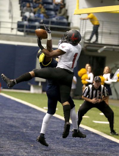 Eastern Washington wide receiver Shaq Hill, right, fights for the ball in the end zone  against Northern Arizona  on Saturday. (JAKE BACON / Associated Press)