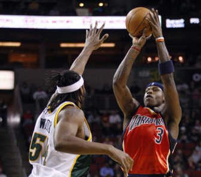 
Golden State's Al Harrington shoots over Seattle's Chris Wilcox during the first half.Associated Press
 (Associated Press / The Spokesman-Review)