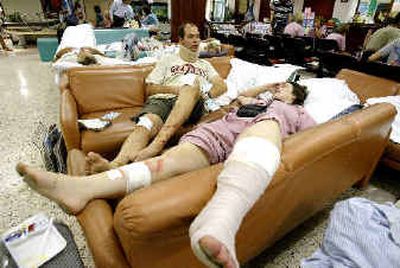 
Injured Western tourists wait for more treatment after being given first aid Sunday at Phuket International Hospital in Phuket, Thailand. 
 (AFP/Getty Images / The Spokesman-Review)