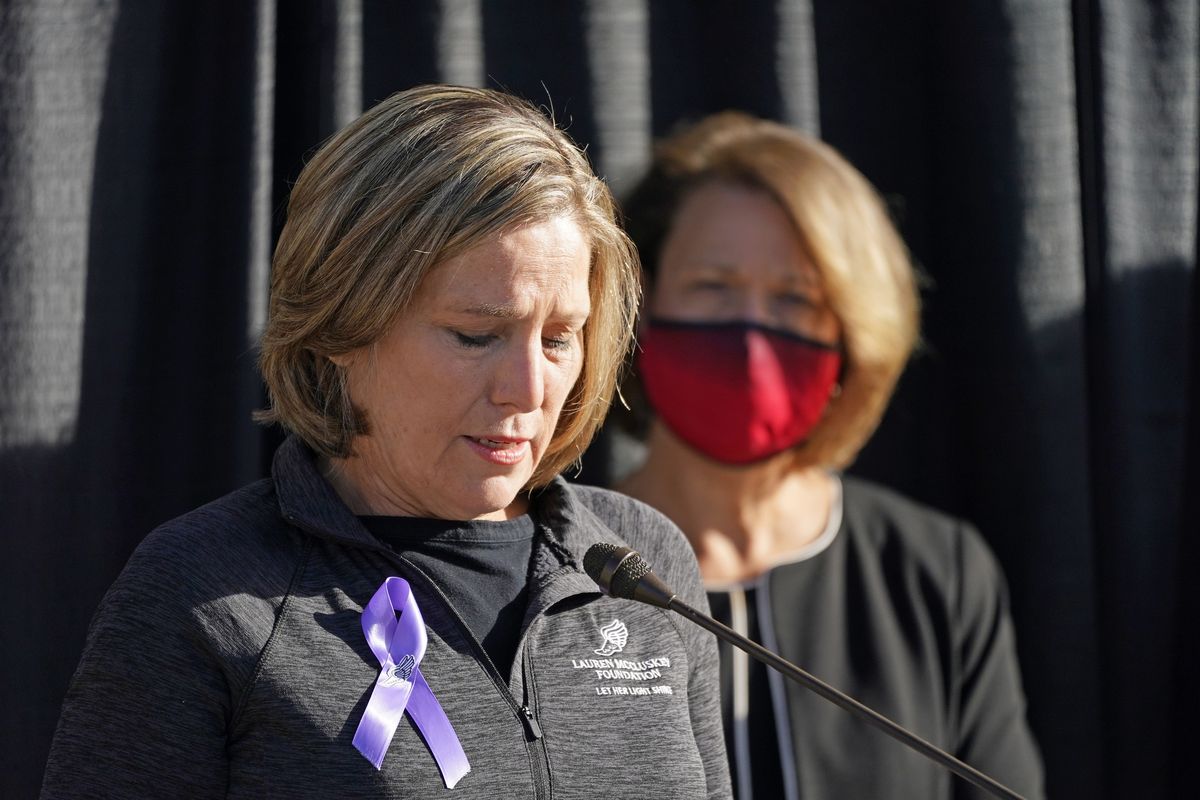 University of Utah President Ruth Watkins, right, looks on as Jill McCluskey, the mother of slain student-athlete Lauren McCluskey, speaks during a news conference Thursday in Salt Lake City. (Rick Bowmer)