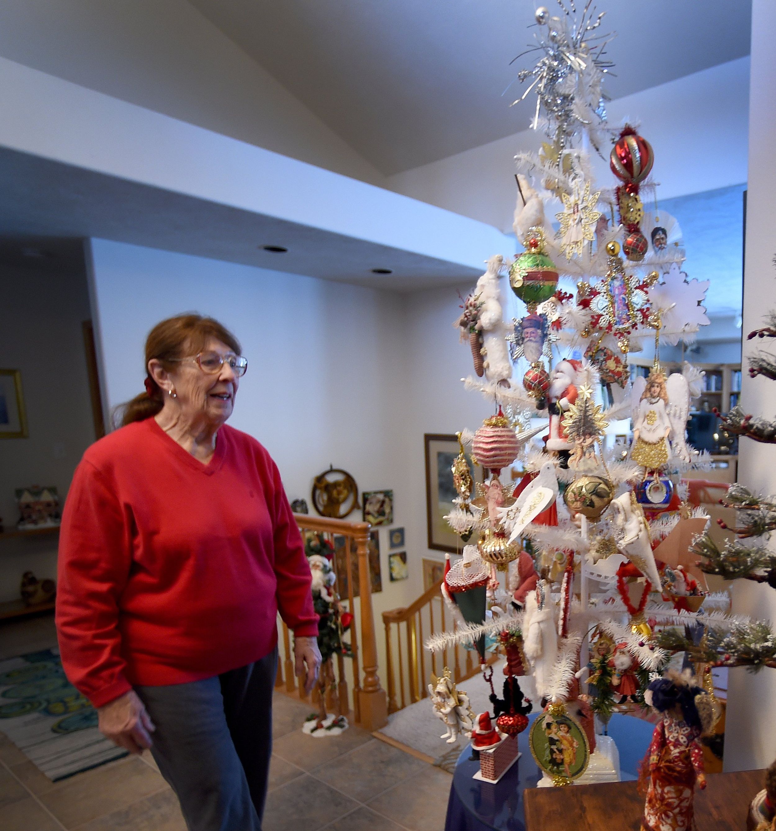 A Christmas tree overloaded with a hodgepodge of sentimental ornaments  accumulated over the years