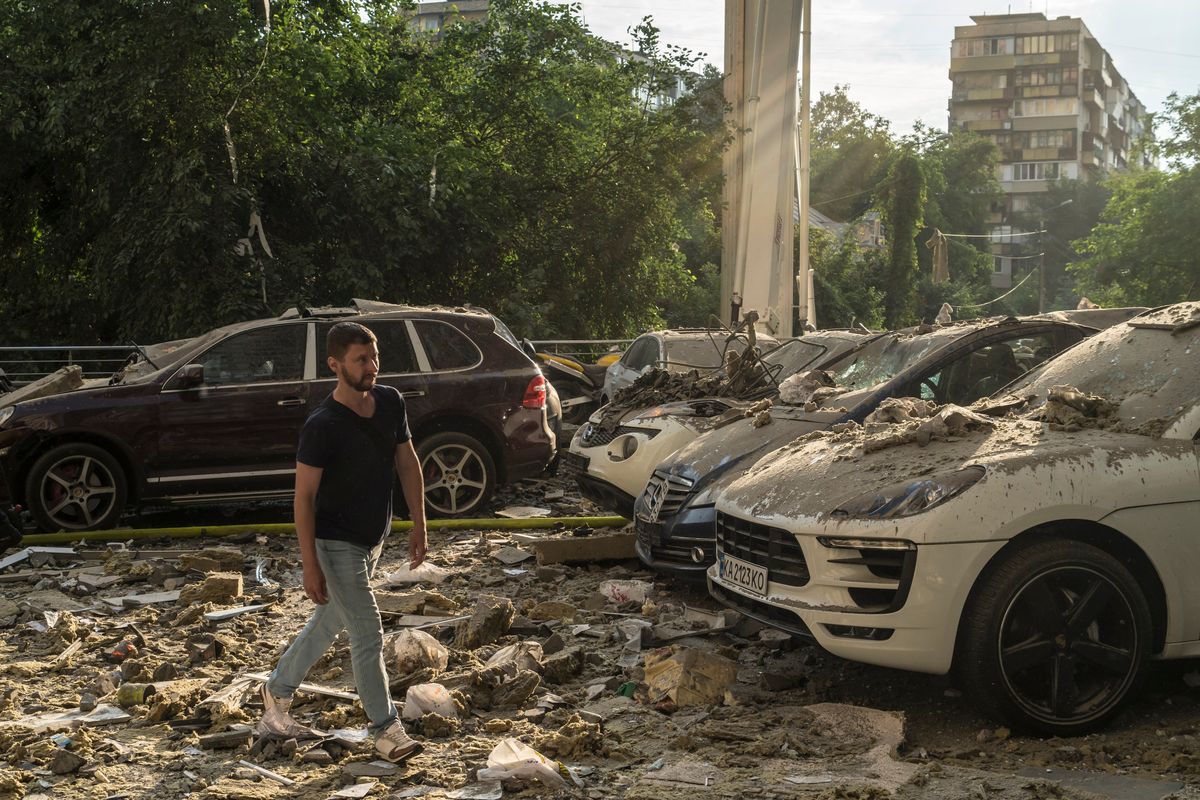 A resident traverses rubble from a high-rise residential building in Kyiv, Ukraine that was hit by a missile early in the morning on Saturday, June 24, 2023. Even with Russia in turmoil amid an apparent attempted coup launched by Yevgeny Prigozhin