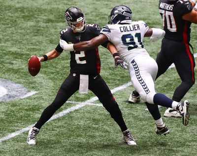 Atlanta Falcons quarterback Matt Ryan is forced to throw it away under pressure from Seattle Seahawks defensive end L.J. Collier during the first quarter on Sunday, Sept. 13, 2020 in Atlanta.  (Curtis Compton/Atlanta Journal-Constitution)