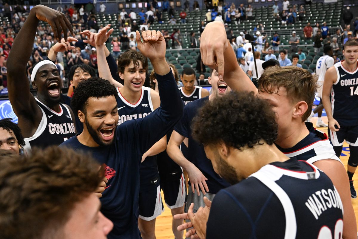 Forward Anton Watson is mobbed by Gonzaga teammates after Watson scored 32 points in a victory over UCLA at the Maui Invitational in Honolulu.  (By Tyler Tjomsland/The Spokesman-Review)