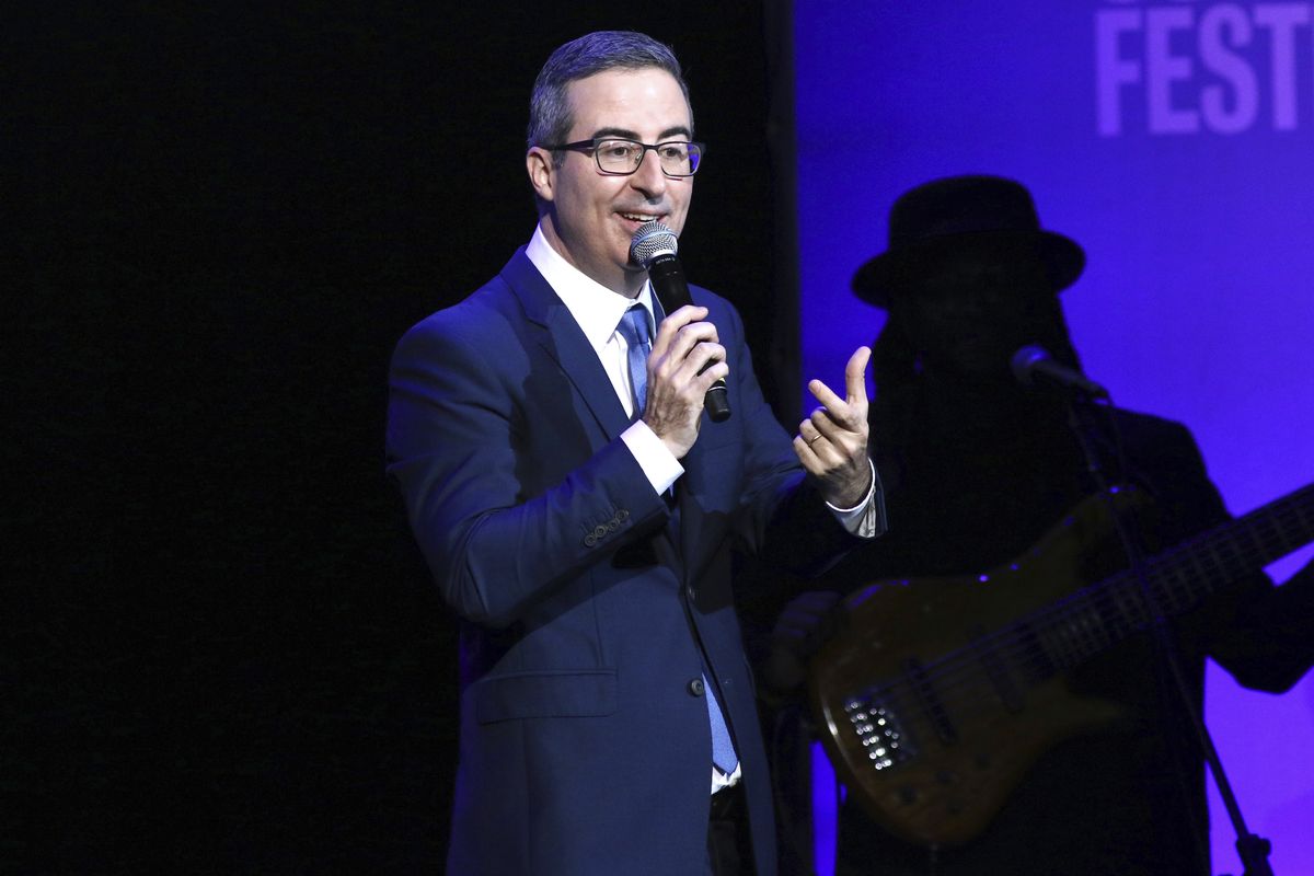 FILE - In this Nov. 4, 2019 file photo, John Oliver performs at the 13th annual Stand Up For Heroes benefit concert in support of the Bob Woodruff Foundation at the Hulu Theater at Madison Square Garden in New York. Danbury, Conn., Mayor Mark Boughton announced a tongue-in-cheek move posted on his Facebook page on Saturday, Aug. 22, 2020, to rename Danbury