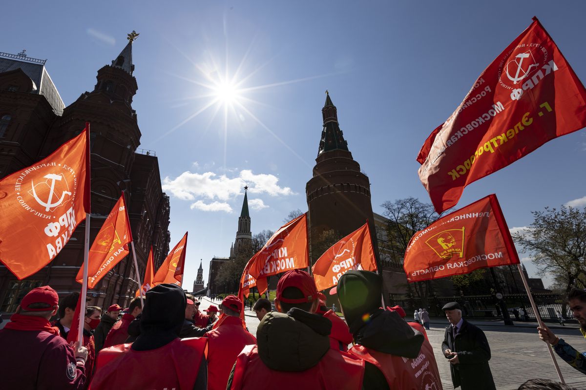 Communists party supporters gather with red flags to mark Labour Day, also knows as May Day near Red Square in Moscow, Russia, Saturday, May 1, 2021.  (Alexander Zemlianichenko)
