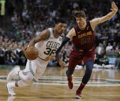 Boston Celtics guard Marcus Smart, left, drives against Cleveland Cavaliers guard Kyle Korver during the second half in Game 2 of the NBA basketball Eastern Conference finals, Tuesday, May 15, 2018, in Boston. (Charles Krupa / Associated Press)