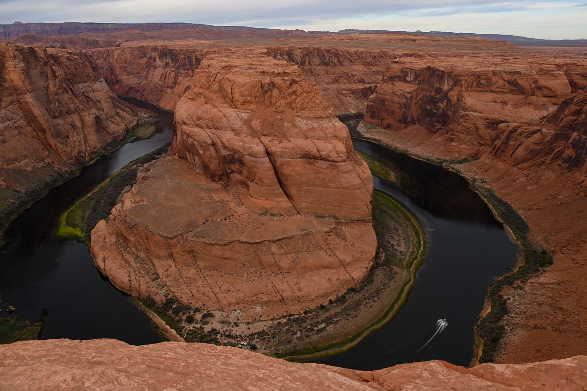 A boat moves around Horseshoe Bend along the Colorado River in Page, Arizona. MUST CREDIT: Joshua Lott/The Washington Post  (Joshua Lott/The Washington Post)