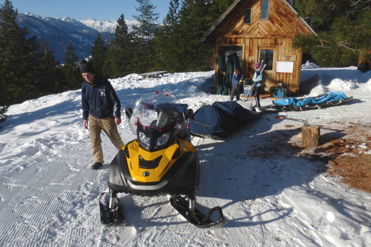 Ben Nelson of Rendezvous Huts delivers gear to clients who’ve skied 9 miles on groomed trails to the Cassal Hut. (Rich Landers)