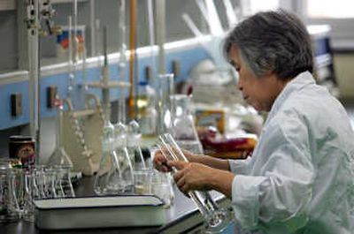 
An inspector examines products at the food safety inspection center of the Beijing Entry-Exit Inspection and Quarantine Bureau in Beijing, China. Associated Press
 (Associated Press / The Spokesman-Review)