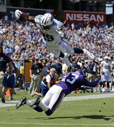 The Titans’ offense is flying high in large part due to a punishing running game led by DeMarco Murray. (Weston Kenney / AP)