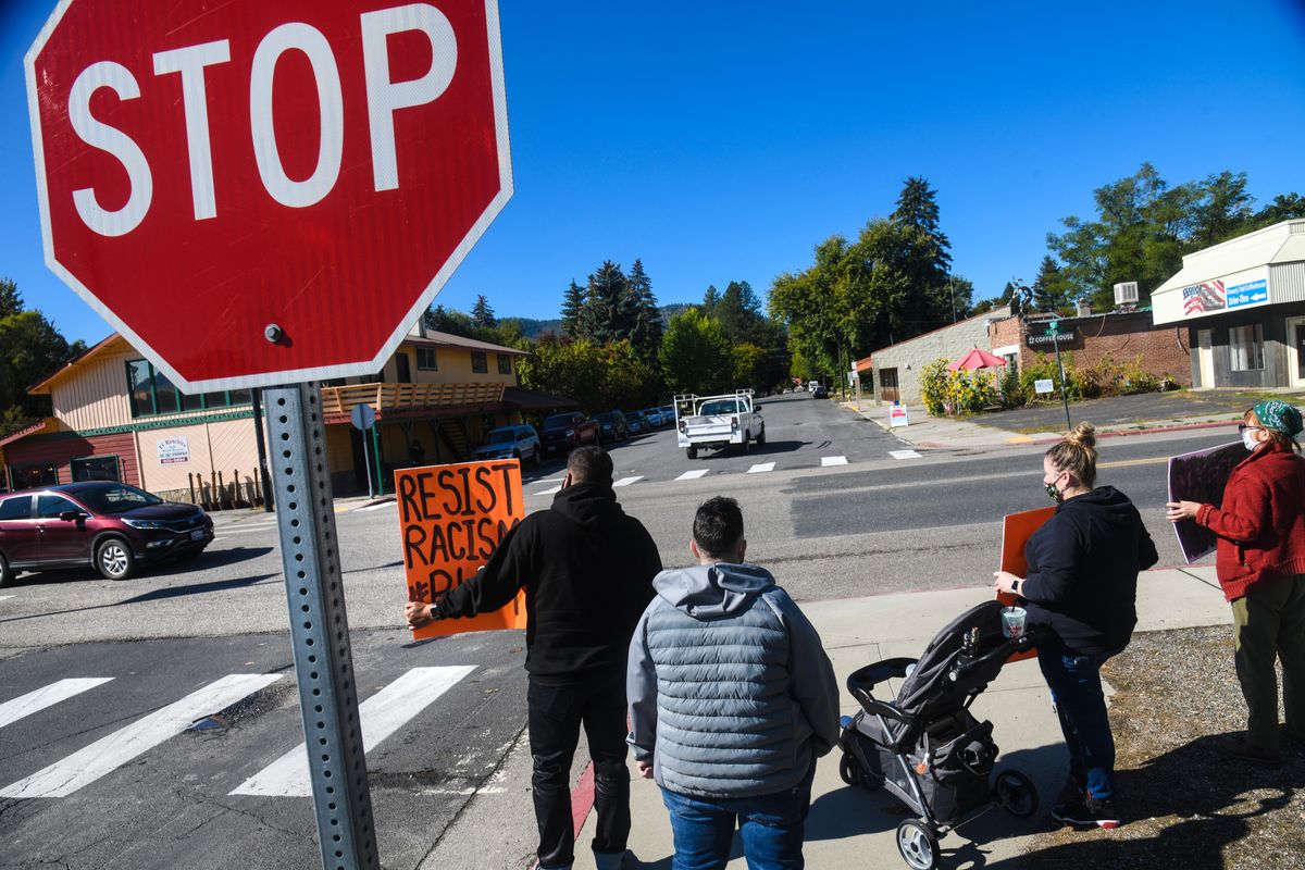 Lakotah Rangel, of Spokane, left with sign, gathers with others on the corner of Park and Webster for the Chewelah United Church of Christ Black Lives Matter vigil, Saturday, Sept. 26, 2020. (DAN PELLE/THE SPOKESMAN-REVIEW)