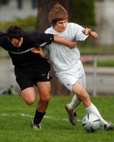 
There's no holding back Ben Funkhouser, right, an EV senior who comes from rich family soccer background. 
 (Kathryn Stevens / The Spokesman-Review)