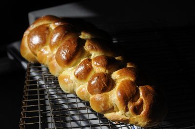A loaf of challah bread, a traditional Jewish egg bread woven with several long pieces of dough, cools after being removed from an oven at Temple Beth Shalom.  (Photos by Jesse Tinsley / The Spokesman-Review)