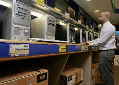 
Hewlett-Packard and Compaq computers are on display at Micro Center computer store in Santa Clara, Calif.. 
 (Associated Press / The Spokesman-Review)