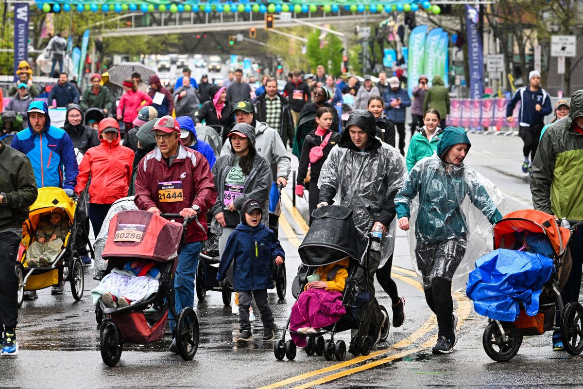 Strollers begin their journey as they head down Riverside Avenue on Sunday during Bloomsday.  (DAN PELLE/THE SPOKESMAN-REVIEW)
