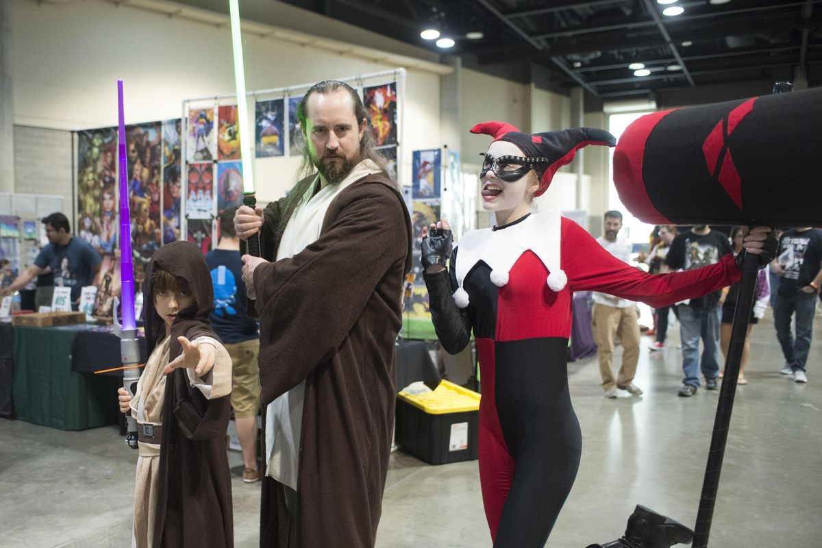 Terrance MacMullan, center, dressed up with children Liam, left, 9, and Sylvia, 13, right to attend the Lilac City Comicon Saturday, June 3, 2017 at the Spokane Convention Center. MacMullan is a philosophy professor at Eastern Washington University and uses the stories found in science fiction and other pop culture references in his class work. (Jesse Tinsley / The Spokesman-Review)