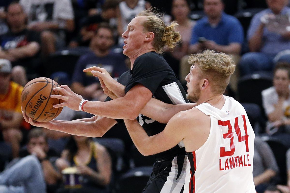San Antonio’s Jeff Ledbetter steals the ball from Atlanta’s Jock Landale during the second half of an NBA Summer League game July 3 in Salt Lake City. (Rick Bowmer / Associated Press)