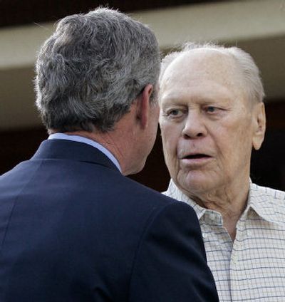 
President Bush  talks with former President Gerald Ford, right, at  Ford's home in Rancho Mirage, Calif., on April 23. 
 (Associated Press / The Spokesman-Review)