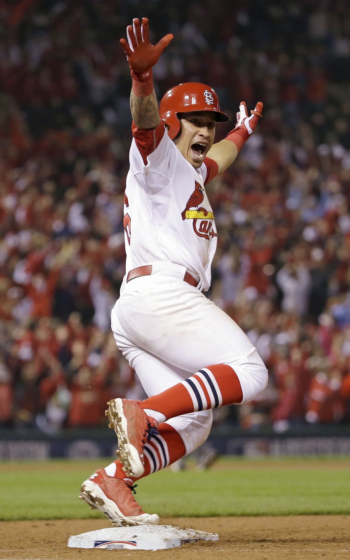 St. Louis Cardinals’ Kolten Wong exults after hitting a walk-off home run to beat the San Francisco Giants 5-4 and even the NLCS at one game apiece. (Associated Press)