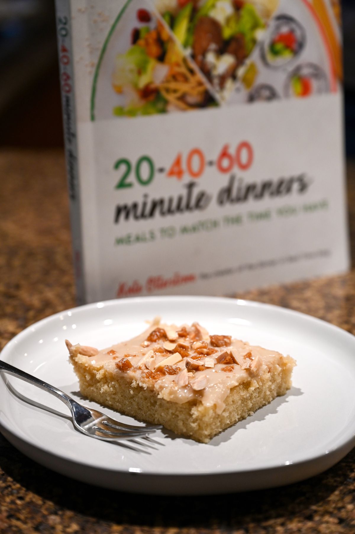 Food blogger Kate Otterstrom shows the gluten-free almond Texas sheet cake she features in a new book: “20-40-60 Minute Dinners: Meals to match the time you have.”  (Jesse Tinsley/The Spokesman-Review)