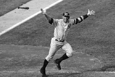 
Alex Rodriguez tosses his bat in the air after hitting a walk-off, three-run homer.
 (Associated Press / The Spokesman-Review)