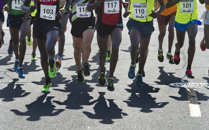 The Men's Elite field cast long shadows as they race down Riverside Avenue durning Bloomsday 2015. (Dan Pelle / The Spokesman-Review)