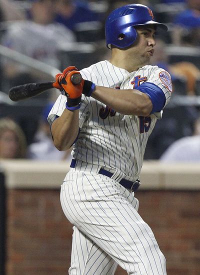 Mets' Carlos Beltran follows through on a two-run homer. He had three RBIs in win. (Associated Press)