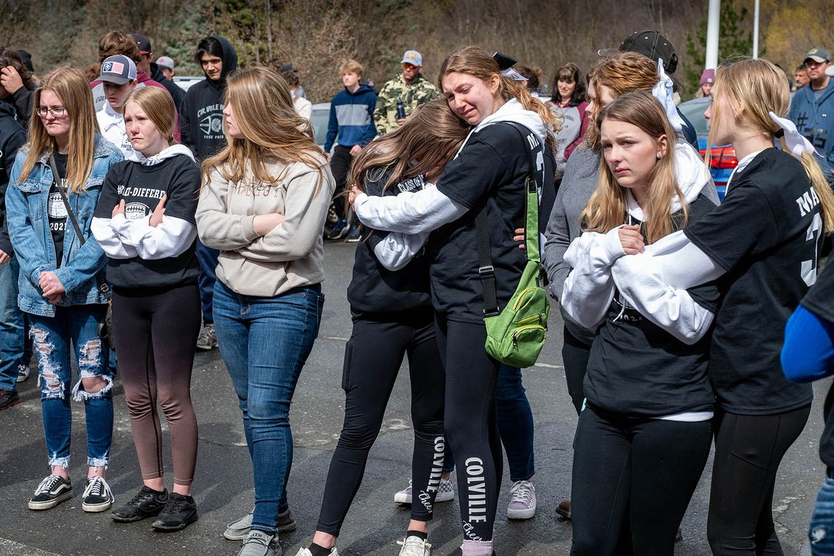 Colville High School students and members of the community gather Saturday outside of Providence Mount Carmel Hospital to grieve the loss of Dale Martin, who was being taken off life support and having his organs donated after he suffered a traumatic football injury April 1. (COLIN MULVANY/THE SPOKESMAN-REVI)