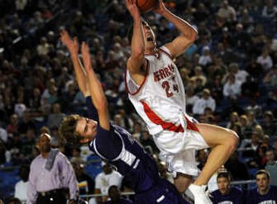 Ferris' Jared Karstetter drives past Garfield's Wilson Platt in the first half. 
 (Rajah Bose / The Spokesman-Review)