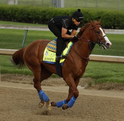 Kentucky Derby faovirite trains at Churchill Downs. The 144th running of the Kentucky Derby will take place Saturday afternoon. (Charlie Riedel / Associated Press)