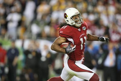 Larry Fitzgerald’s 64-yard catch-and-run for a touchdown resulted in a happy, but short-lived lead for the Cardinals.  (Associated Press / The Spokesman-Review)