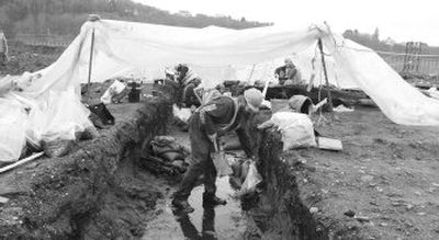 
Archaeologists worked beside the construction in 2004 before the tribe pulled their support of the Hood Canal construction yard. Eventually, the tribe will rebury the intact remains of 337 ancestors at the site.  
 (Associated Press file photos / The Spokesman-Review)