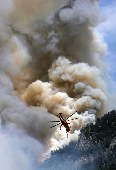 Air crews battle a wildfire near Alpine, Utah, on July 4. (Associated Press)