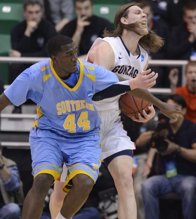 Gonzaga’s Kelly Olynyk, right, and Southern’s Javan Mitchell banged underneath the basket all game long. (Colin Mulvany)