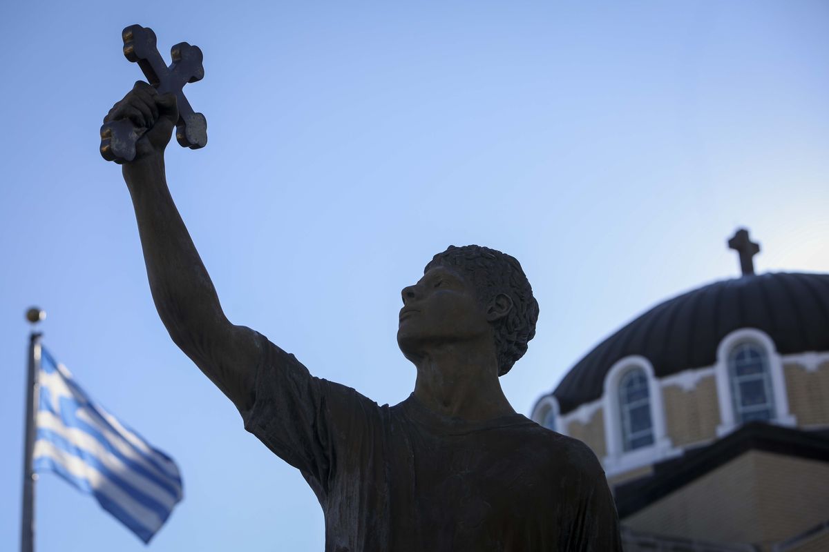 A statue of a cross retriever seen outside St. Nicholas Greek Orthodox Cathedral in Tarpon Springs, Florida.  (Ivy Ceballo)