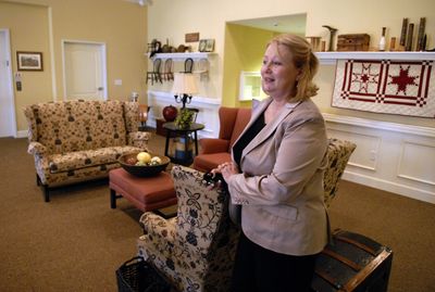 Guardian Angel Homes administrator Joan Estudillo stands in the second floor sitting area of the new Colonial House Assisted Living Home in Liberty Lake.   (J. BART RAYNIAK / The Spokesman-Review)