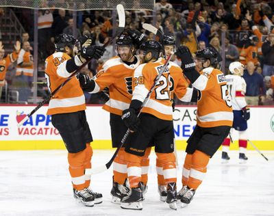 Philadelphia Flyers' Sean Couturier, center left, celebrates his goal with teammates during the second period of an NHL hockey game against the Florida Panthers, Tuesday, Oct. 17, 2017, in Philadelphia. (AP Photo/Chris Szagola) ORG XMIT: PACS106 (Chris Szagola / AP)