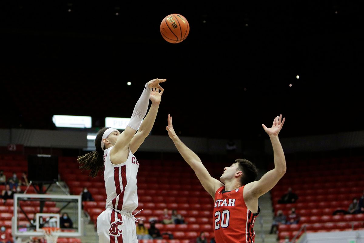 Washington State guard Tyrell Roberts, left, shoots over Utah guard Lazar Stefanovic during the second half of an NCAA college basketball game, Wednesday, Jan. 26, 2022, in Pullman, Wash. Washington State won 71-54.  (Associated Press)