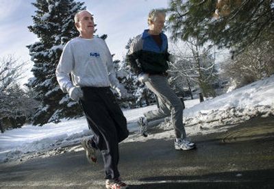 
Dennis Hession runs through Riverfront Park with his friend Steve McNutt during his lunch hour Wednesday. Hession will take over as acting mayor after Jim West's recall is certified. 
 (Holly Pickett / The Spokesman-Review)