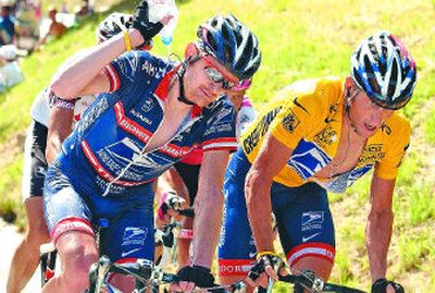 
American Floyd Landis, left, riding with compatriot Lance Armstrong in 2004, has been under attack for doping.
 (Associated Press / The Spokesman-Review)