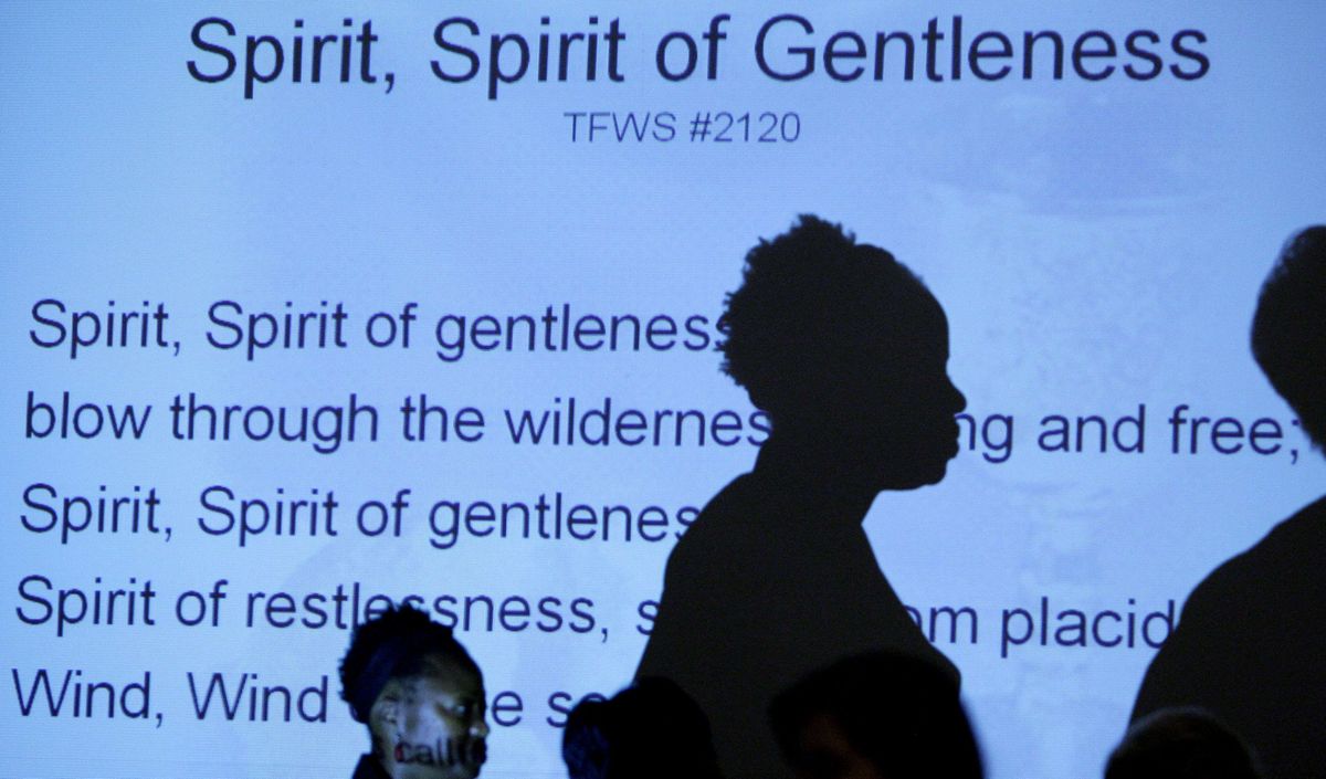 Female pastors sing as the words to the hymn are shown on a screen during a service at a United Methodist Church gathering of female pastors in Nashville, Tenn., last fall. (The Spokesman-Review)