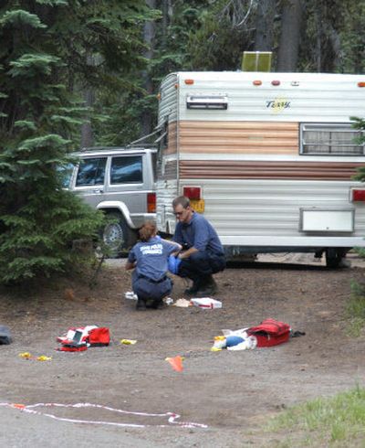
Investigators collect evidence Thursday at the scene of a Wednesday night shooting at Crater Lake National Park in Oregon, which resulted in the death of a camper by a park ranger. The man, whose name was withheld pending notification of relatives, was pronounced dead at the scene. 
 (Associated Press / The Spokesman-Review)