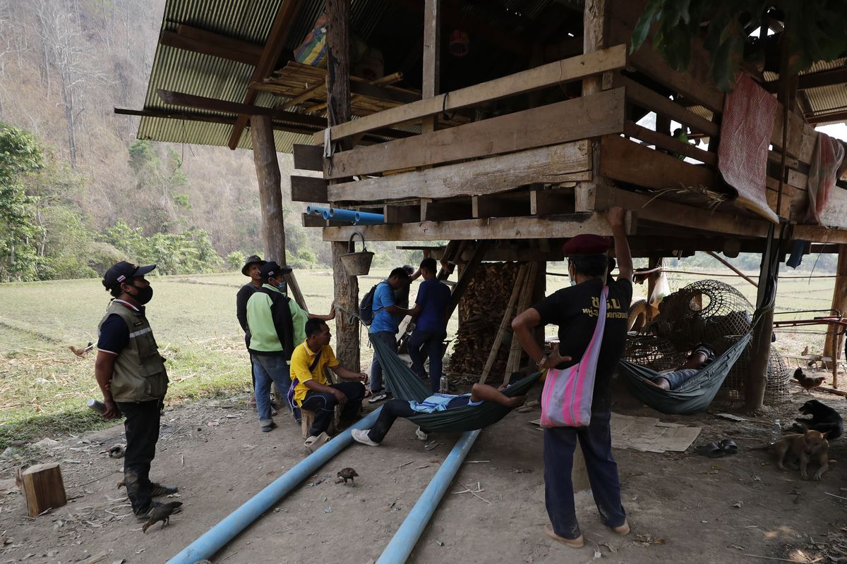 Thai villagers visit a checkpoint of the Thai Rangers in Mae Sakoep village in Mae Hong Son province, Thailand, Monday, March 29, 2021, where people from neighboring Myanmar arrived after they had fled from their homes, following airstrikes by Myanmar
