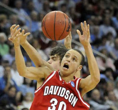 
Davidson's Stephen Curry played a little defense, too, here stealing a pass intended for Gonzaga's Matt Bouldin. 
 (Dan Pelle / The Spokesman-Review)