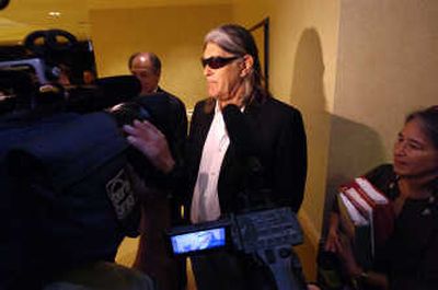 
University of Colorado professor Ward Churchill, center, speaks to reporters Tuesday before a board of regents meeting was held to discuss his future. The board voted to fire him.Associated Press
 (Associated Press / The Spokesman-Review)