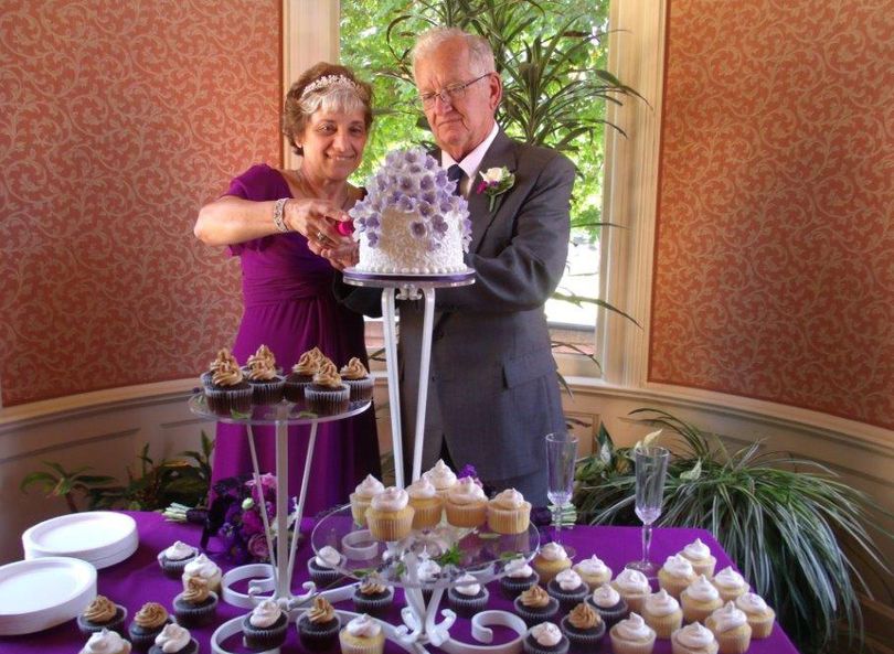 Theresa Phillips, 68, and Joe Phillips, 81, cut the cake after their wedding ceremony in Spokane on July 20.
