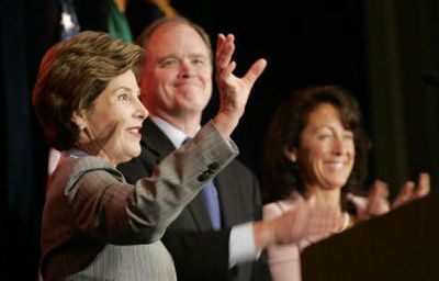 
First lady Laura Bush, left, waves as she stands with Republican Senate candidate Mike McGavick and his wife, Gaelynn, on Wednesday  after a fundraiser in Bellevue, Wash. 
 (Associated Press / The Spokesman-Review)